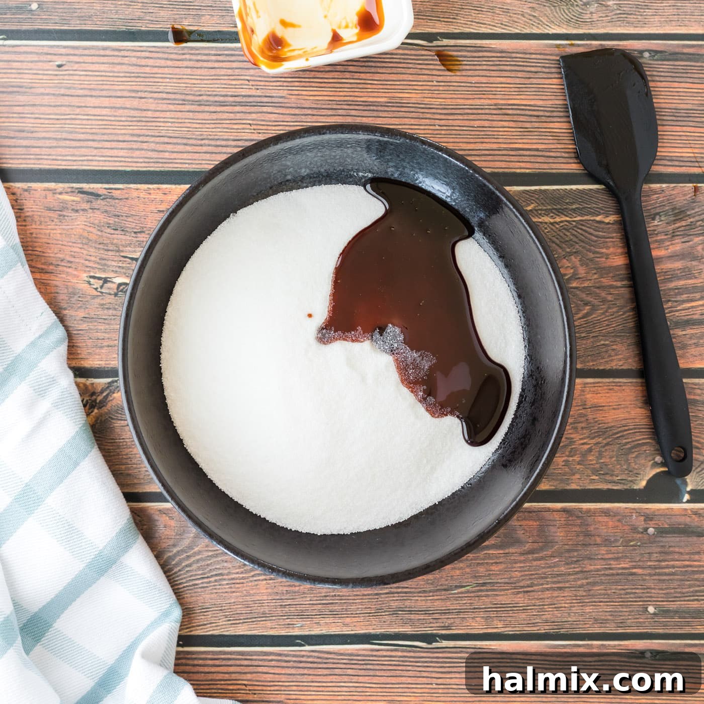 Smart Swaps for Brown Sugar 5 Molasses drizzled over granulated sugar in a bowl