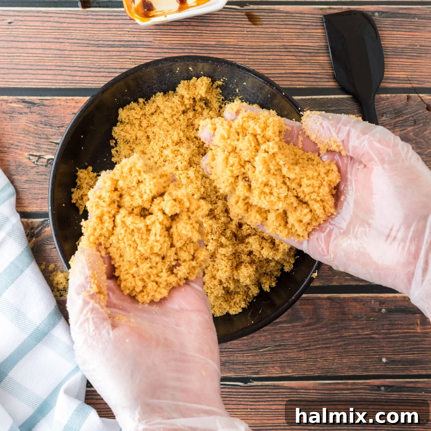 Smart Swaps for Brown Sugar 7 Hands holding a scoop of perfectly mixed homemade brown sugar