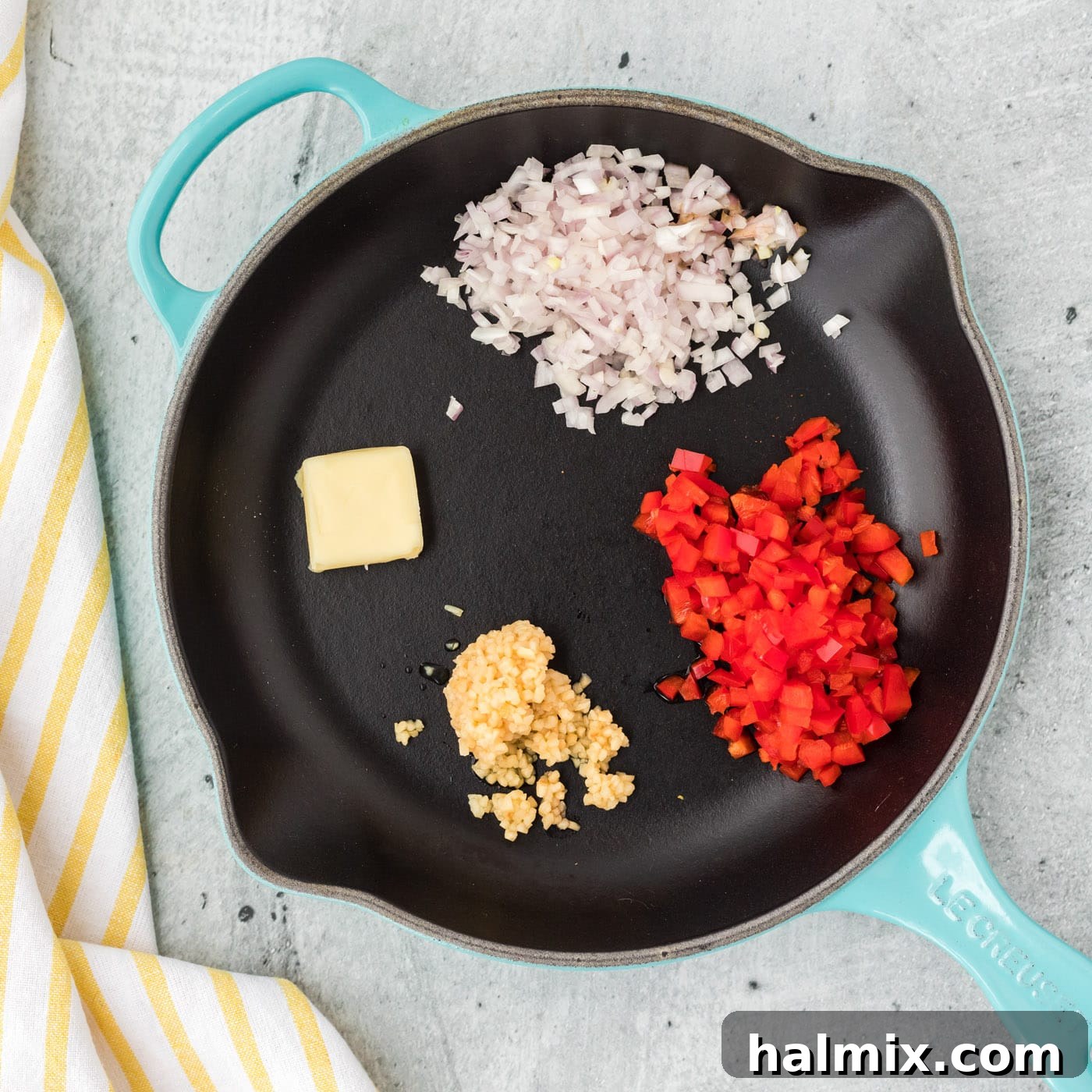 Golden Crab Delights 5 red bell pepper, shallots, and garlic with butter in a skillet