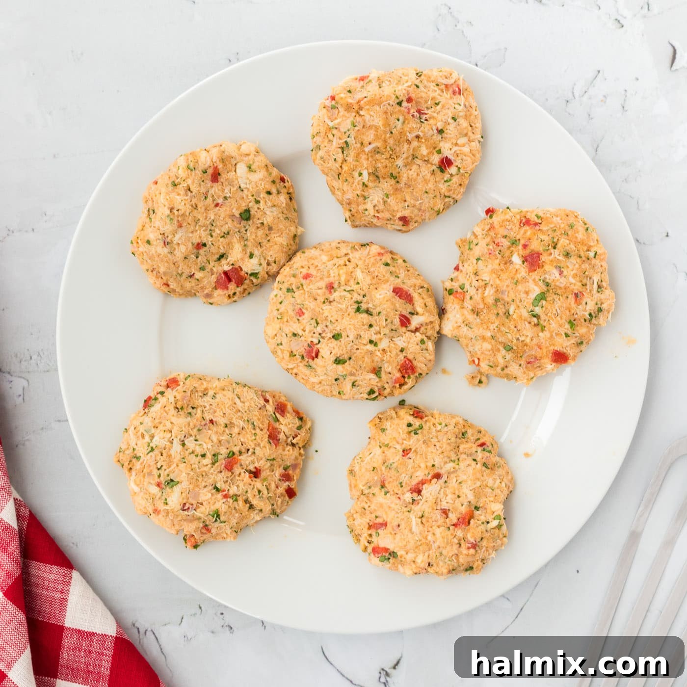 Golden Crab Delights 7 crab cake patties on a plate