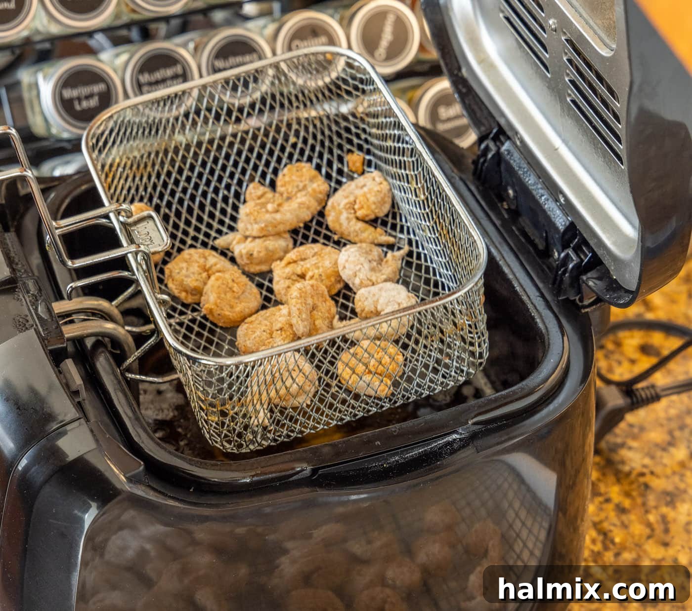 Golden Shrimp Poppers 11 breaded shrimp in deep fryer basket