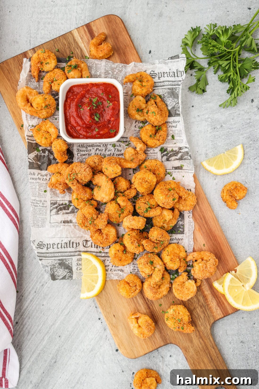Golden Shrimp Poppers 3 Popcorn Shrimp on a cutting board