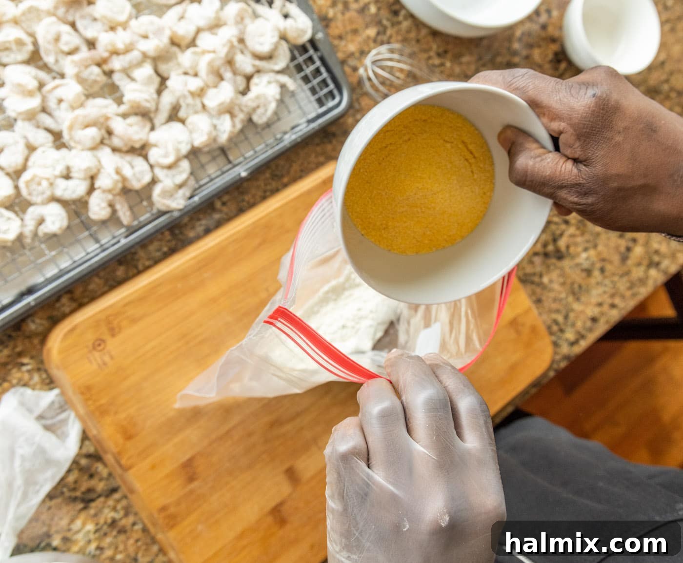 Golden Shrimp Poppers 7 adding cornmeal to a bag of flour