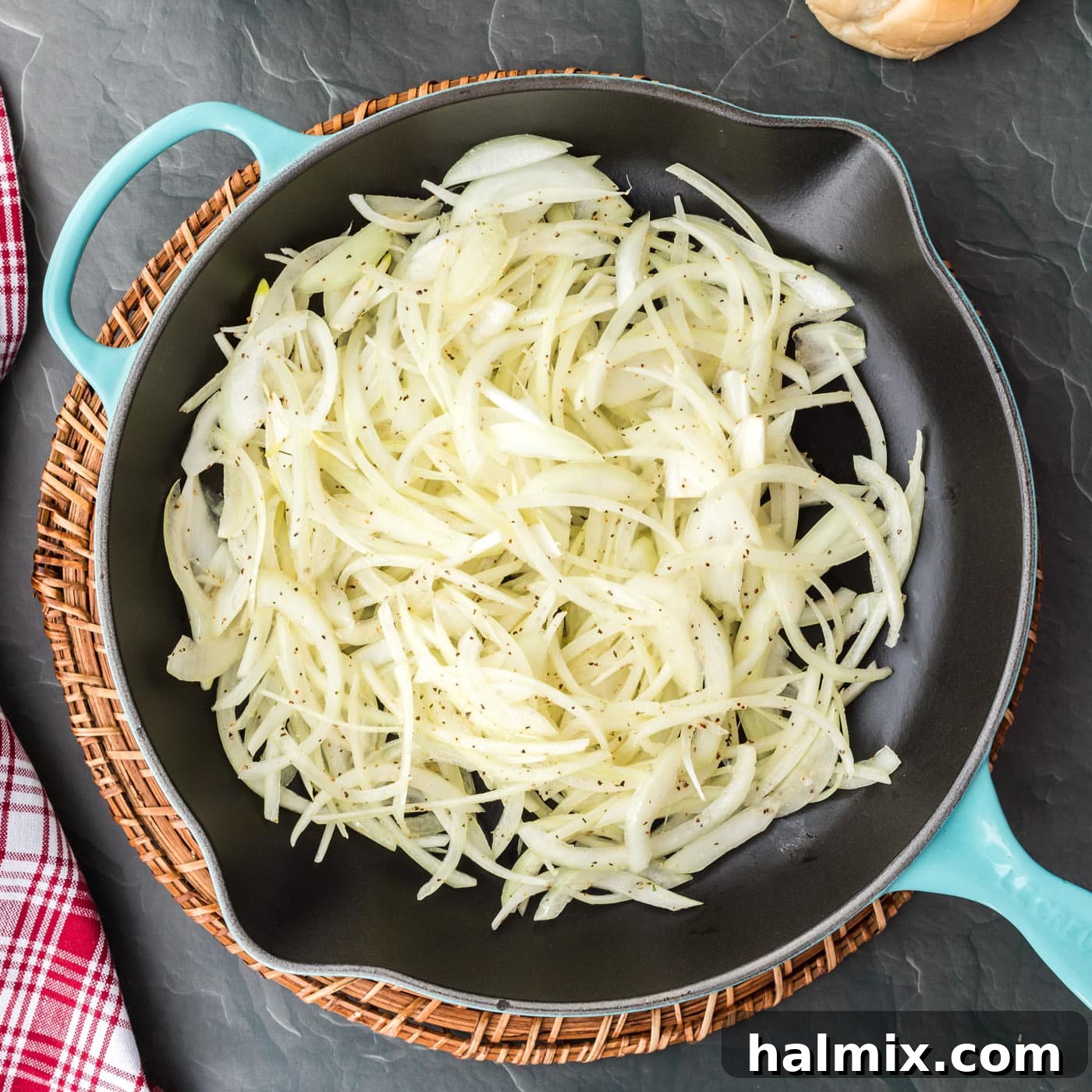 The Quintessential Philly Steak Sandwich 7 sliced onions in a skillet