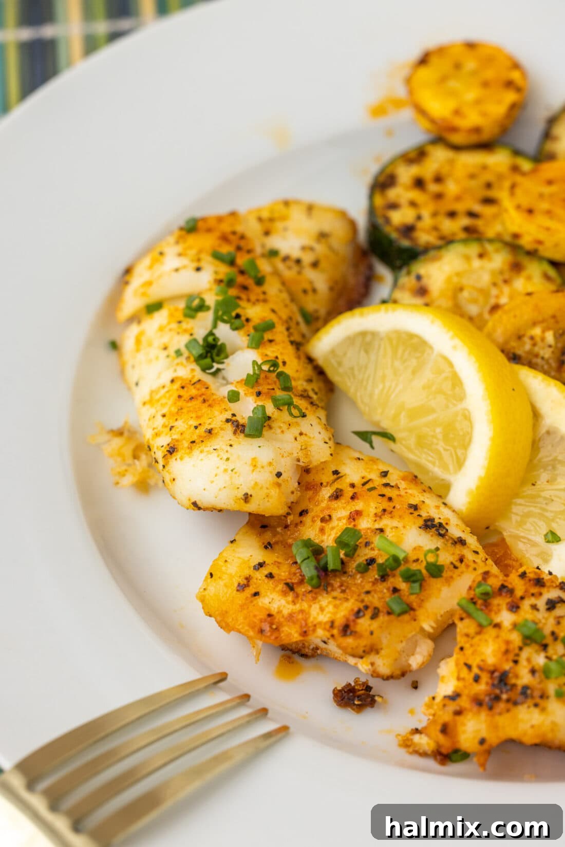A beautifully plated dish of baked orange roughy, ready to be enjoyed