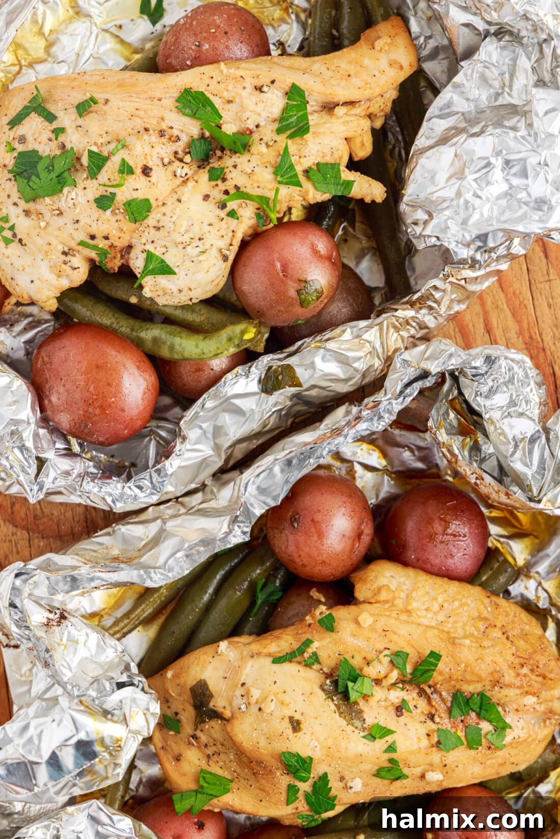 Easy Campfire Foil Meals 2 Campfire Foil Packets with marinated chicken, green beans, and baby potatoes