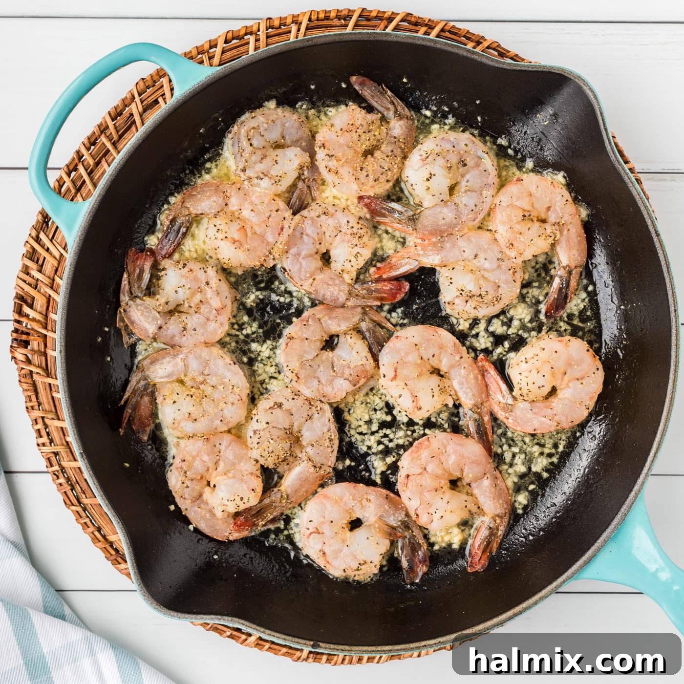 Bright Garlic Shrimp Scampi Pasta 6 shrimp scampi cooking in a skillet with garlic butter sauce