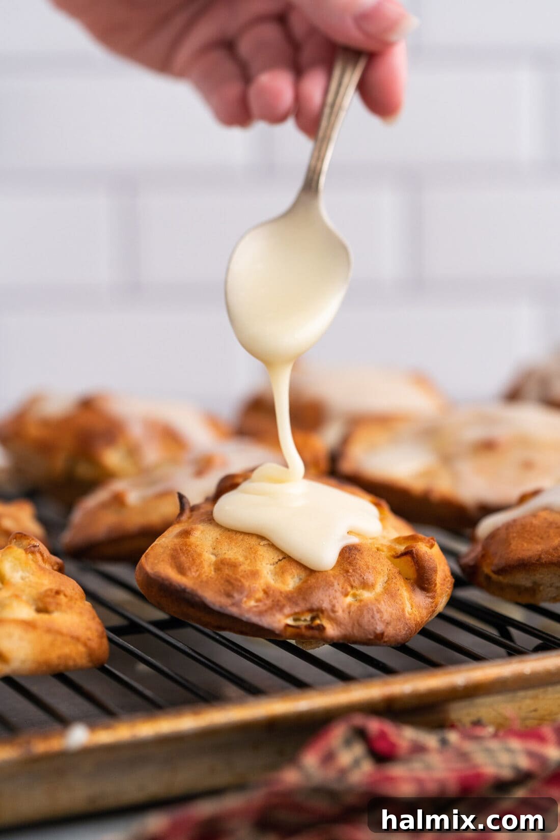 adding glaze to Air Fryer Apple Fritters