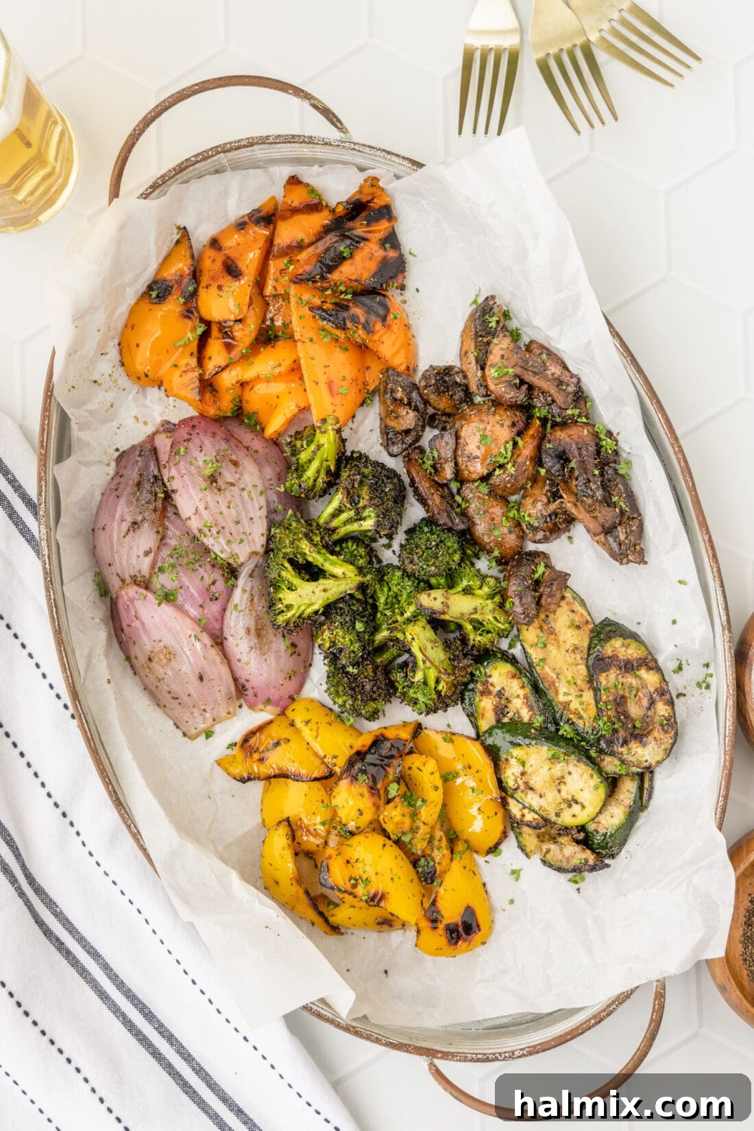 Flame-Kissed Veggie Delights 10 A large platter generously filled with a vibrant assortment of perfectly grilled vegetables.