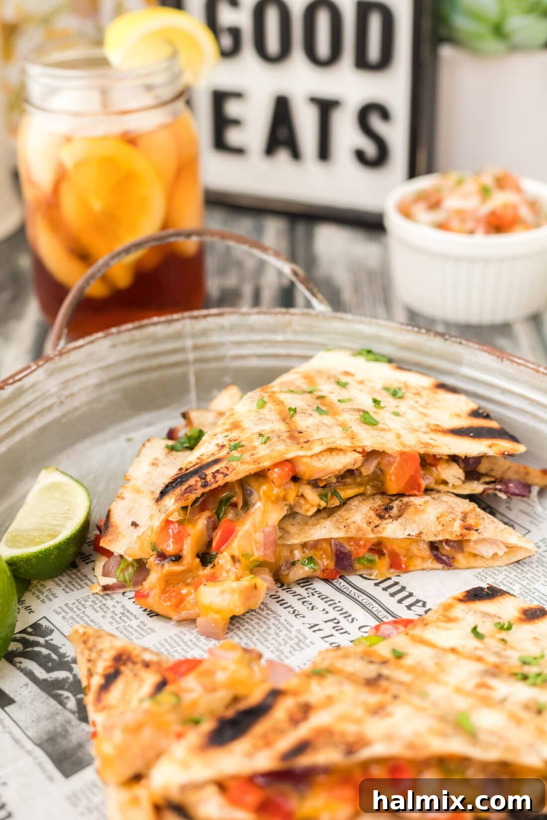 Grilled Chicken & Cheese Fiesta 2 Grilled Chicken Quesadilla on a platter, cut into triangles and ready to serve
