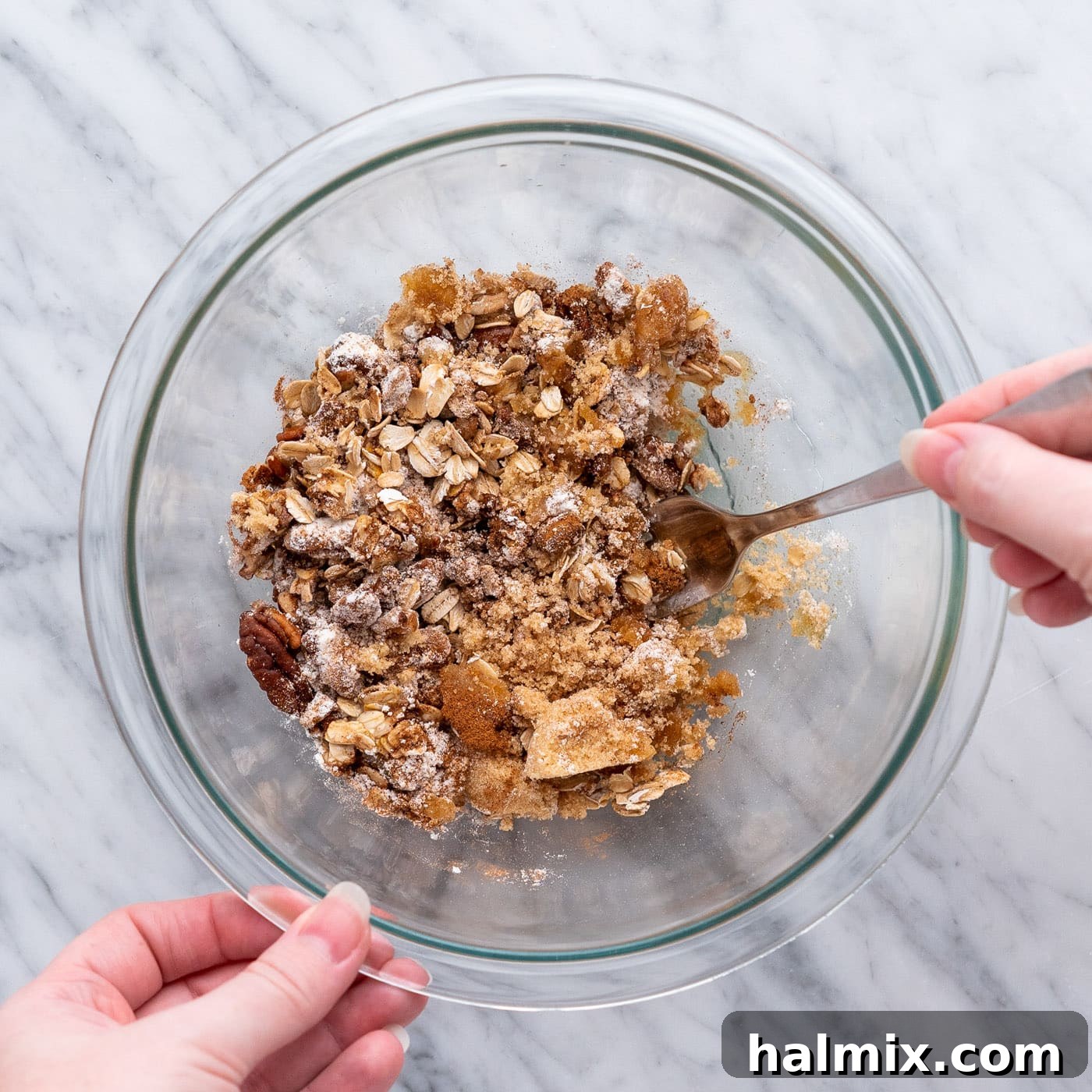 Air Fried Apple Delights 8 A close-up of the filling mixture being stirred in a bowl, showing how the melted butter binds the ingredients.