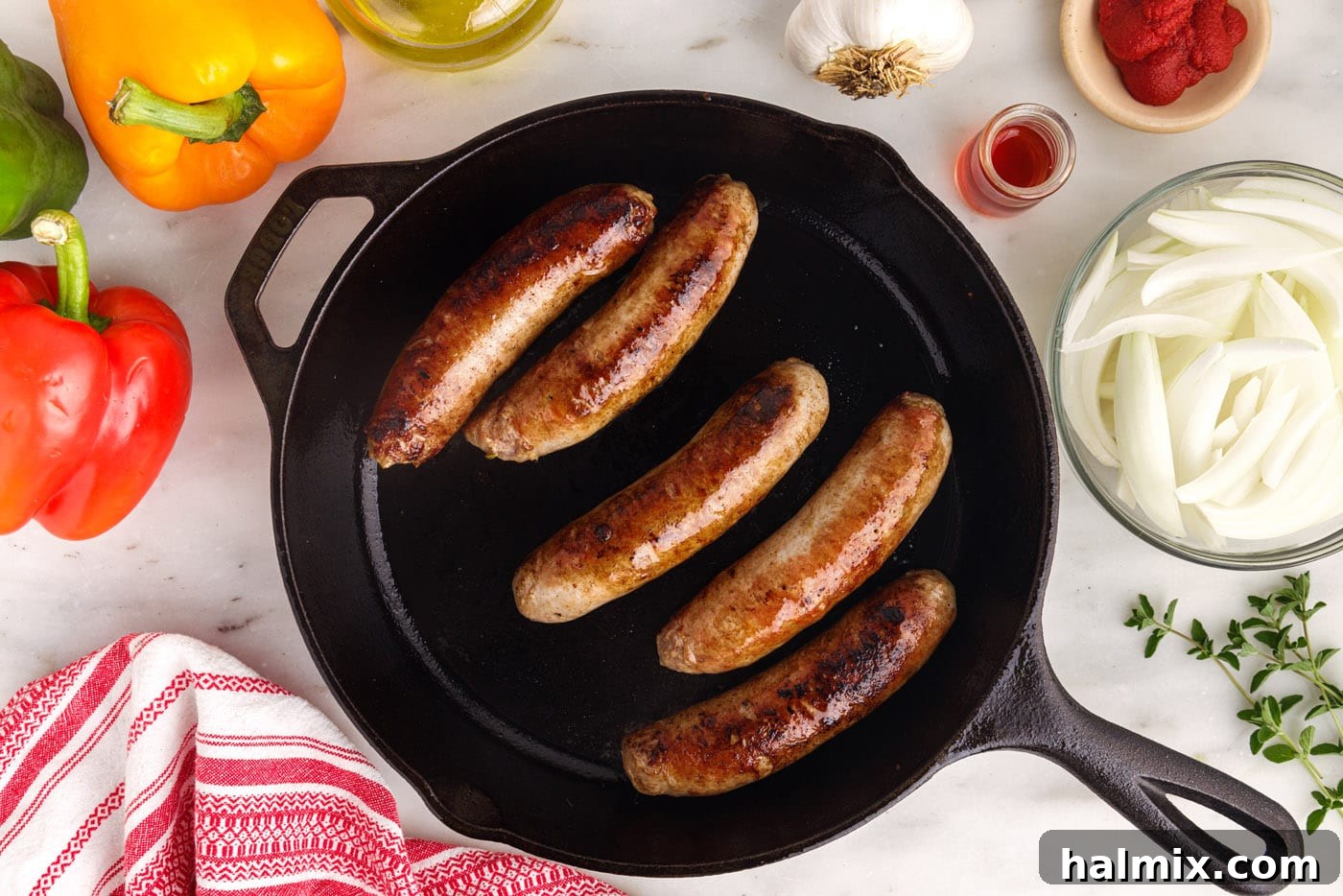 Italian sausage seared on all sides in a skillet