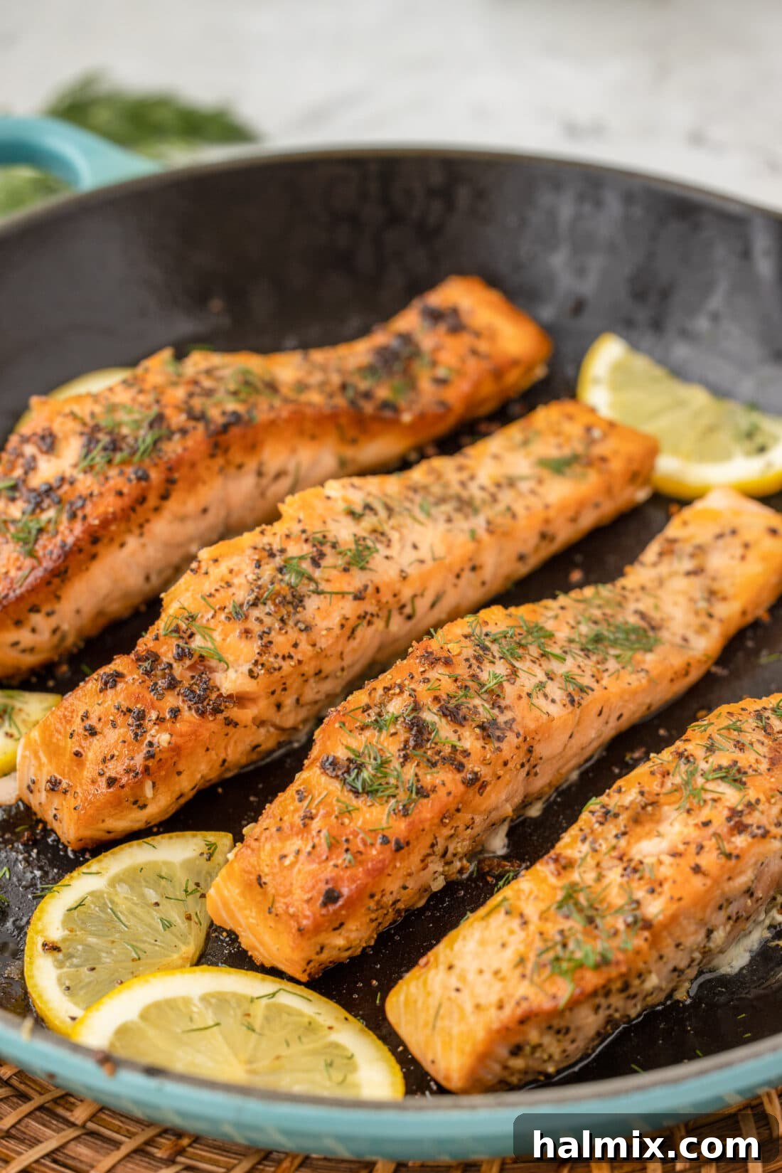 Perfectly Golden Seared Salmon 2 Pan Seared Salmon in skillet with a delicate golden crust