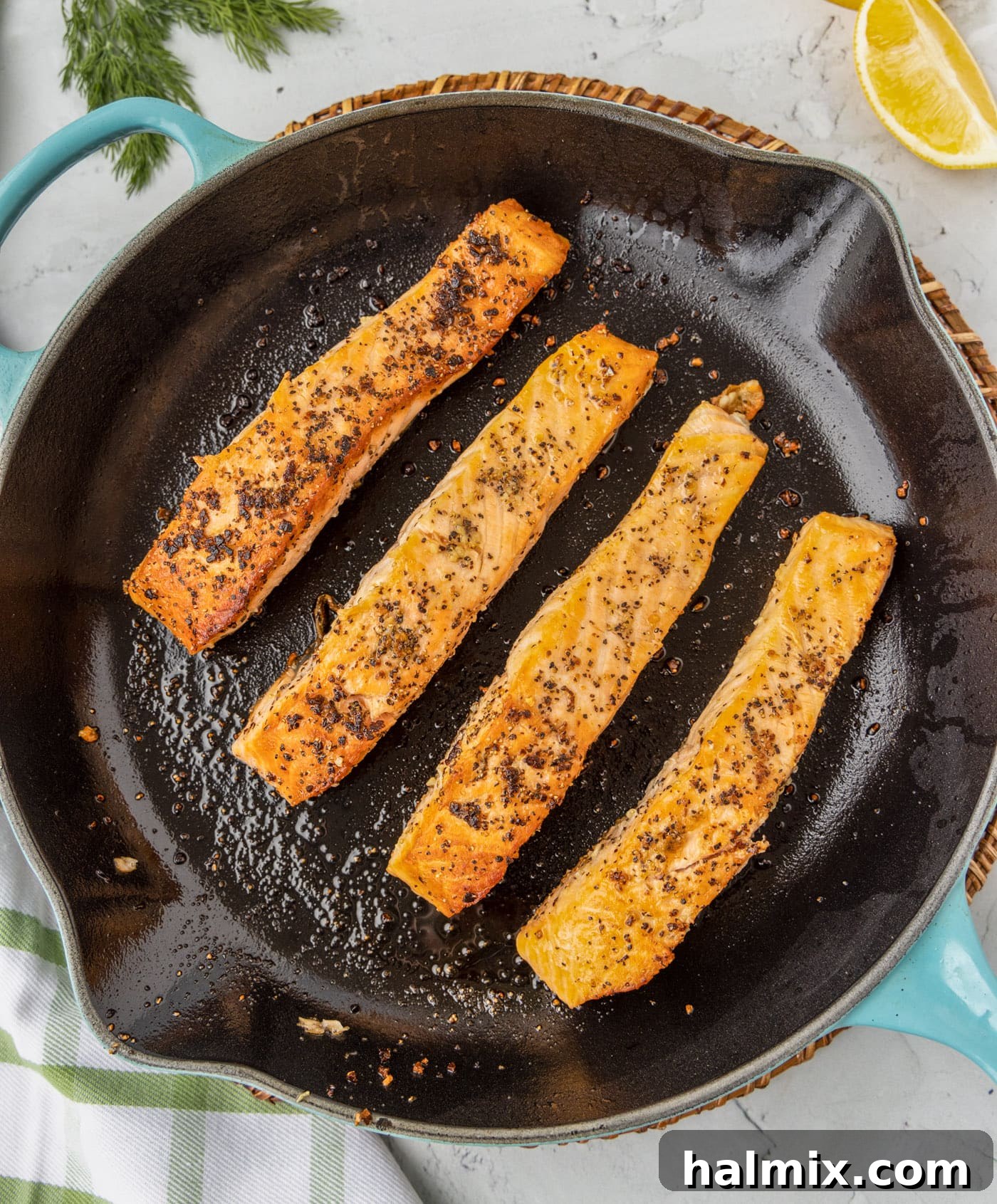 Perfectly Golden Seared Salmon 6 Salmon pan-frying in a hot skillet, developing a crispy crust