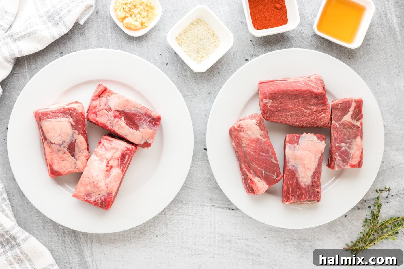 Beef short ribs on plates, one before rinsing and one after