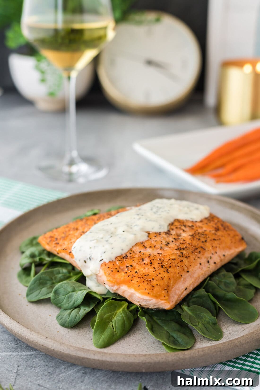 Velvet Rosemary Cream 3 A perfectly cooked salmon fillet generously drizzled with the lush, green-flecked Rosemary Cream Sauce, highlighting its rich texture and appetizing appeal.