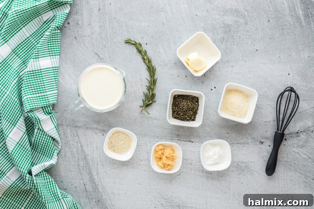 Velvet Rosemary Cream 4 All the fresh ingredients neatly arranged for making Rosemary Cream Sauce: butter, garlic cloves, fresh rosemary sprigs, a bottle of heavy cream, a block of parmesan cheese, garlic salt, and a small container of cornstarch.