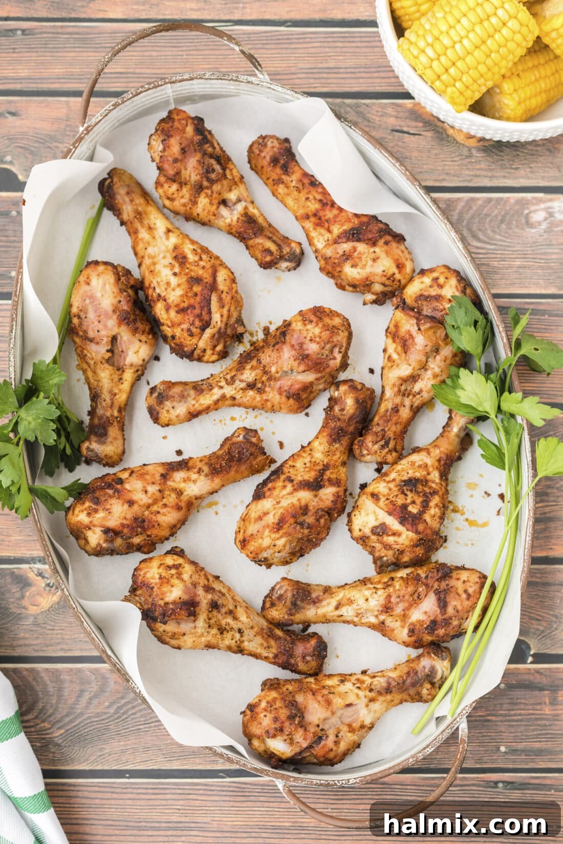 Golden Brown Baked Drumsticks 2 Crispy golden baked chicken legs on a serving platter