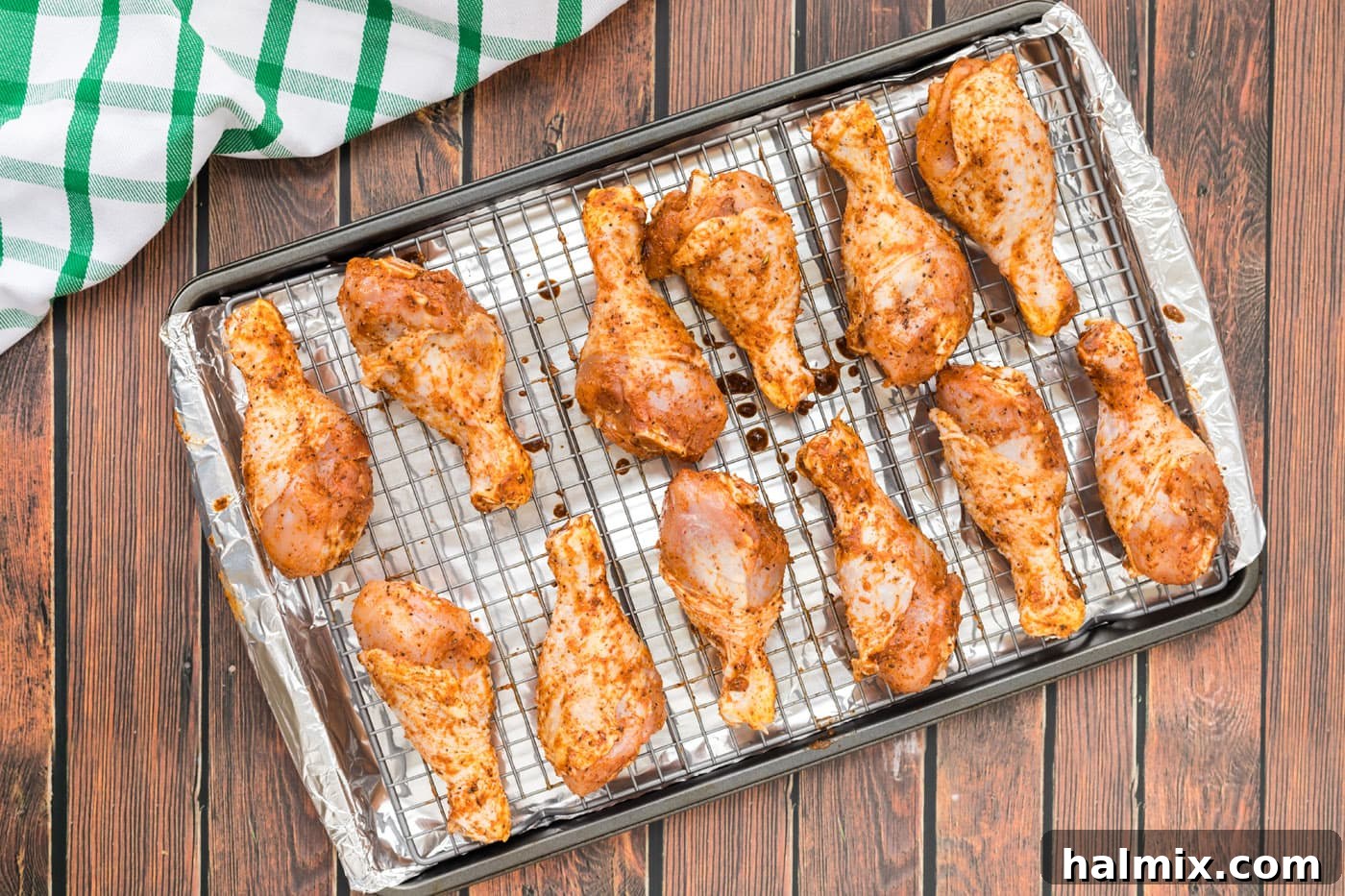 Golden Brown Baked Drumsticks 7 Seasoned chicken legs arranged on a wire rack for baking