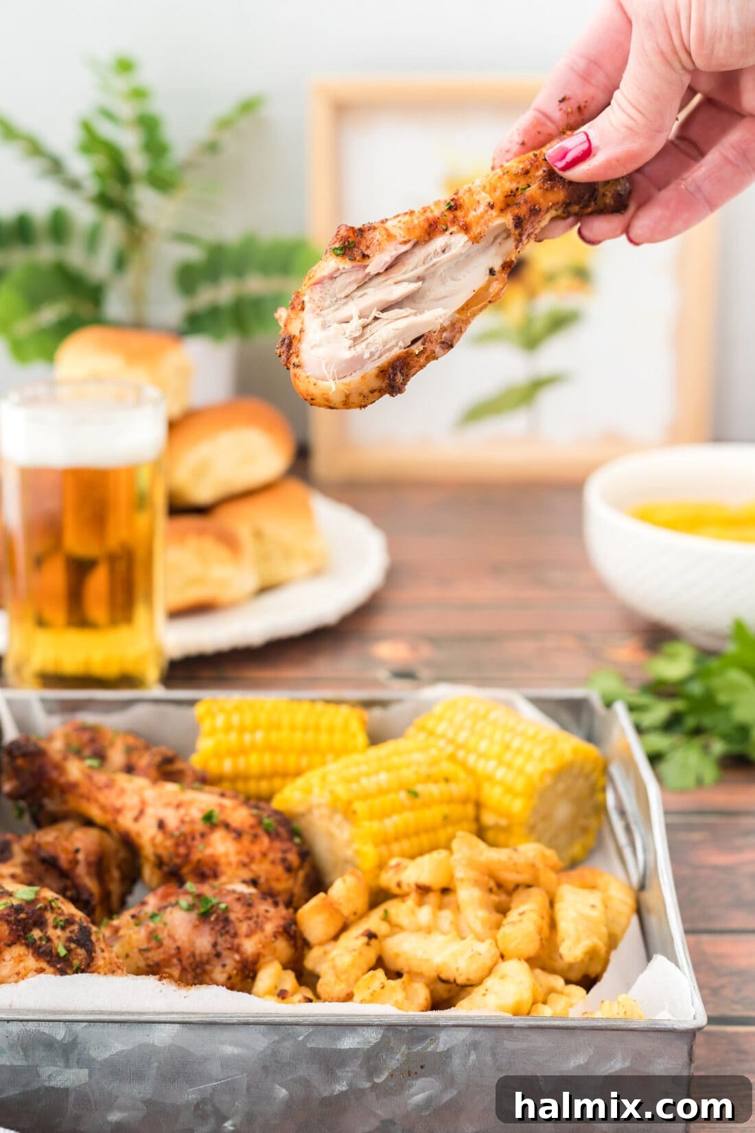 Golden Brown Baked Drumsticks 9 Baked Chicken Leg with a bite taken out, showing juicy interior