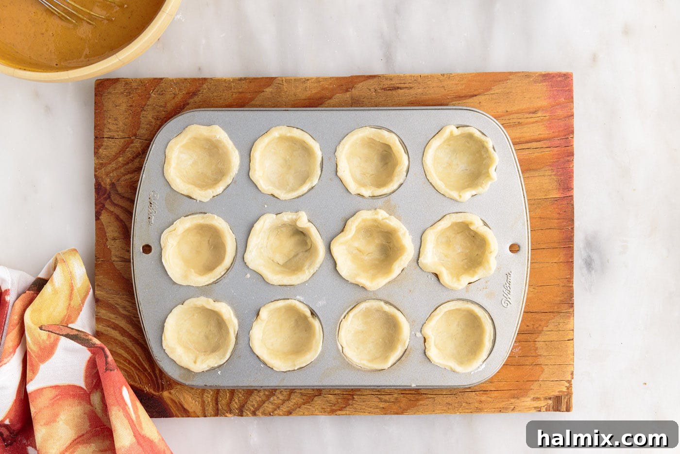 Petite Pumpkin Delights 12 mini pie dough in a muffin tin
