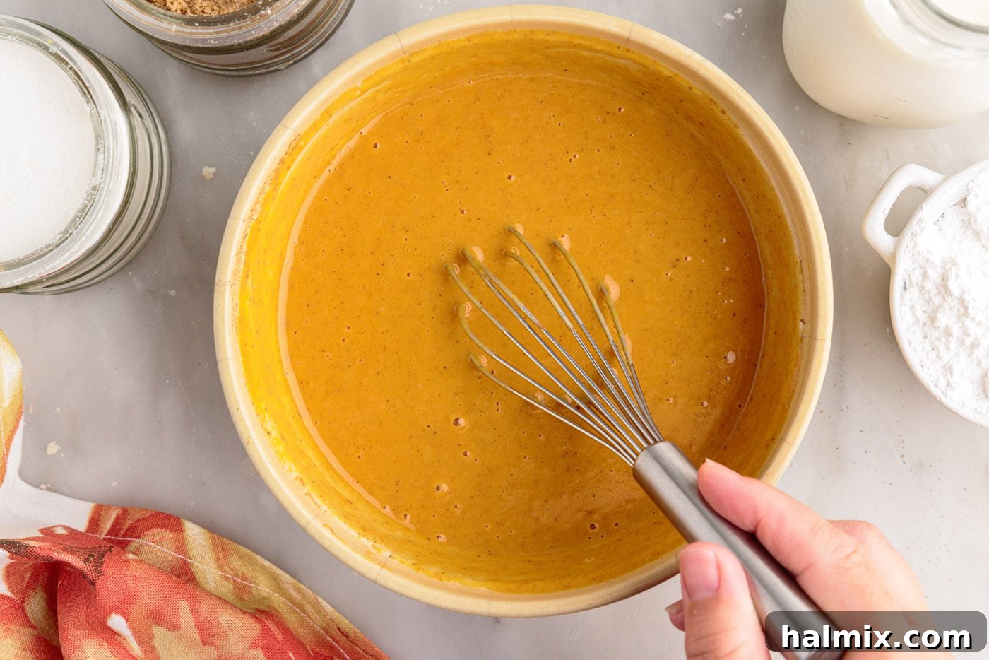 Petite Pumpkin Delights 13 pumpkin pie filling in a bowl with a whisk