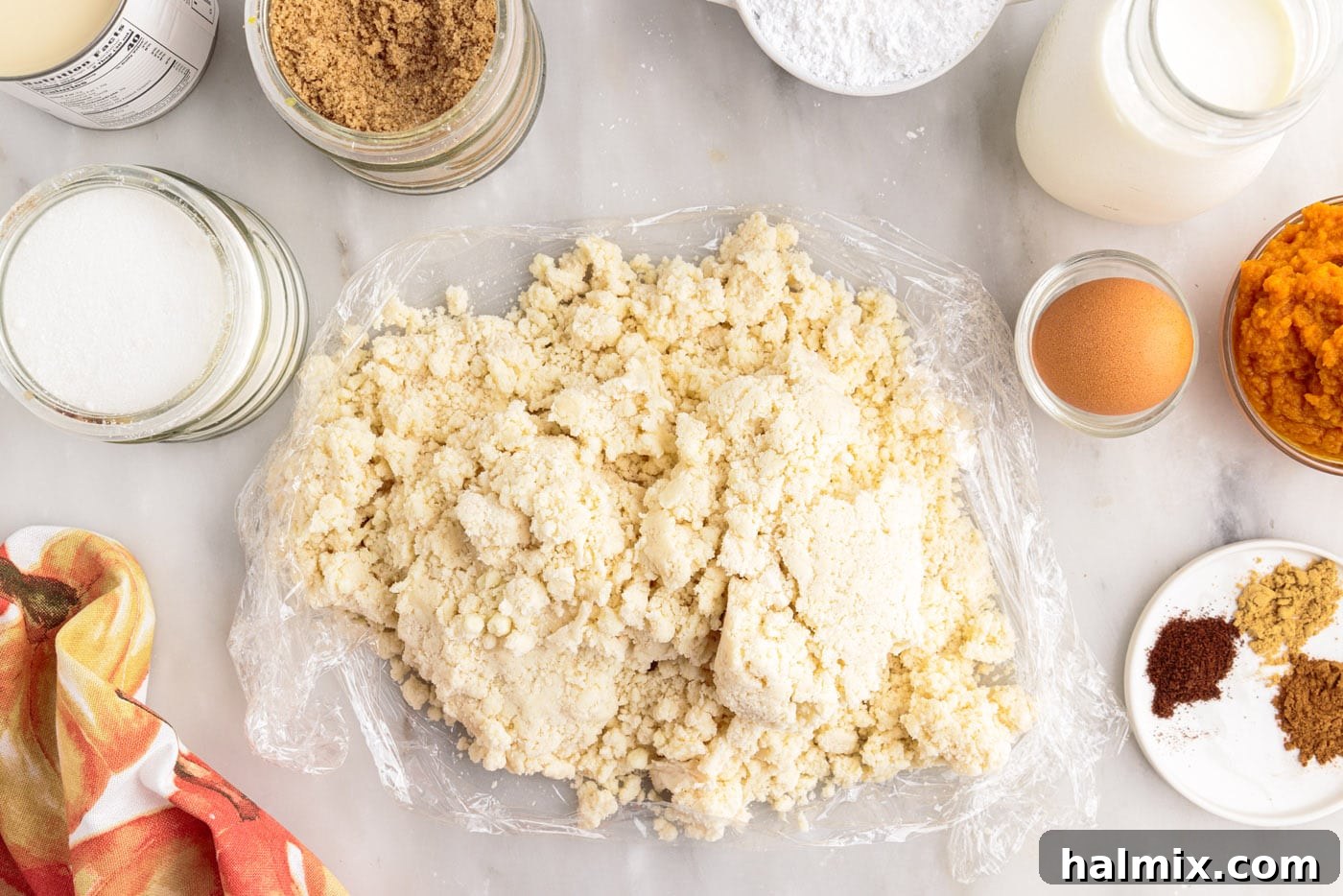 Petite Pumpkin Delights 8 pie dough on top of plastic wrap
