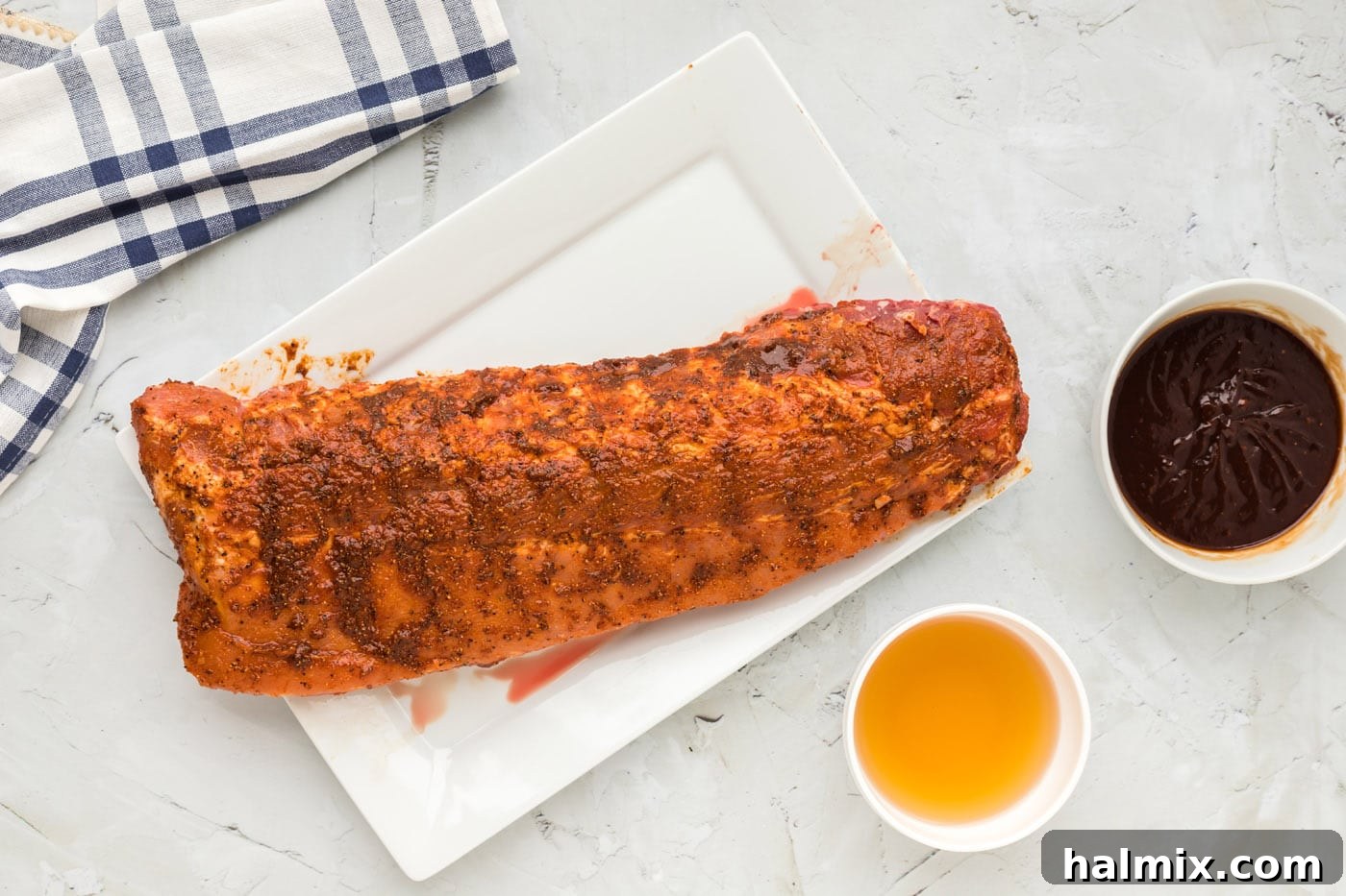 baby back ribs covered in a wet rub