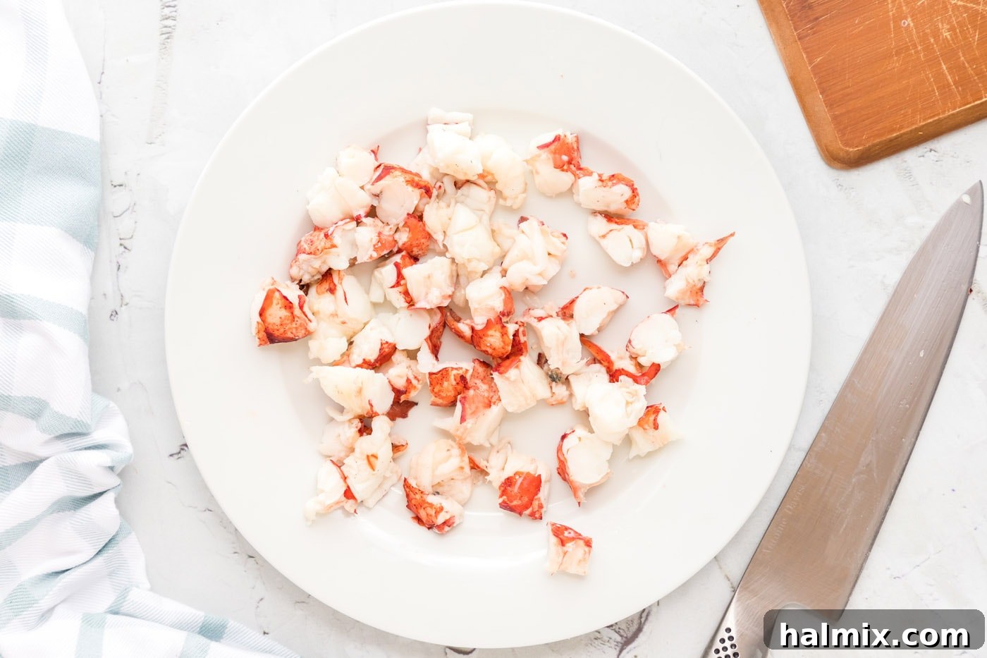 lobster meat chunks on a plate, ready for the mac and cheese