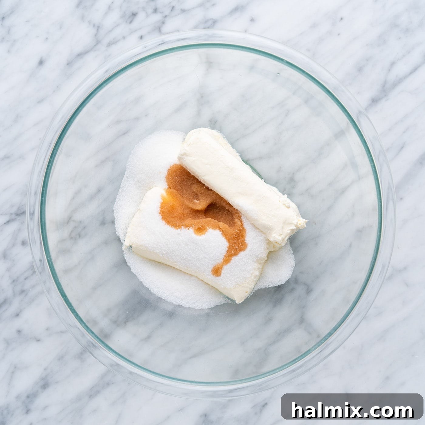 Spiced Apple Caramel Cheesecake Bars 11 cream cheese, sugar and vanilla in a mixing bowl