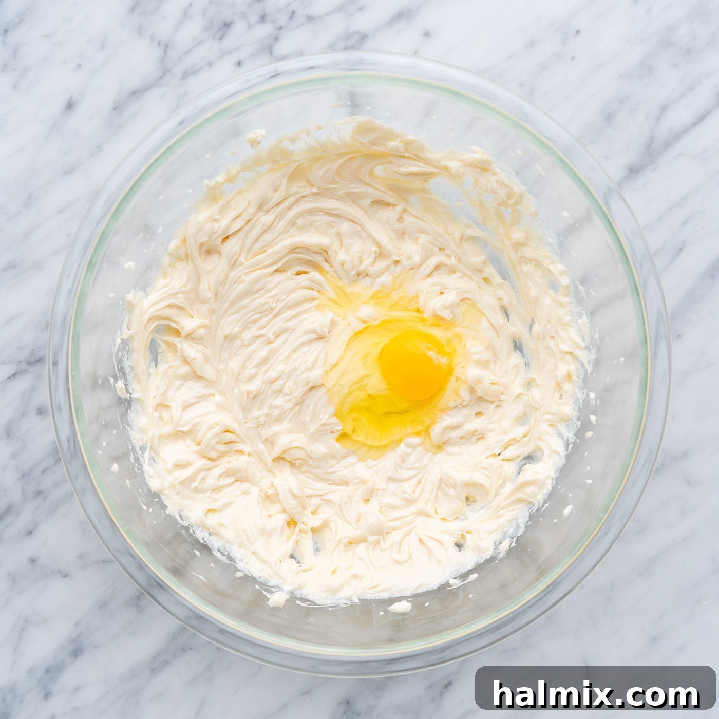 Spiced Apple Caramel Cheesecake Bars 12 beating eggs into cream cheese mixture