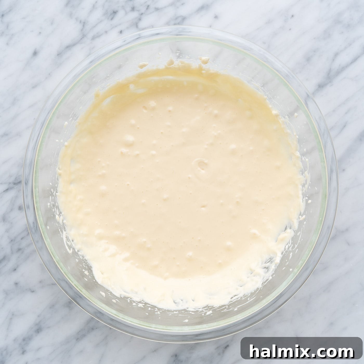 Spiced Apple Caramel Cheesecake Bars 13 cheesecake mixture in a bowl