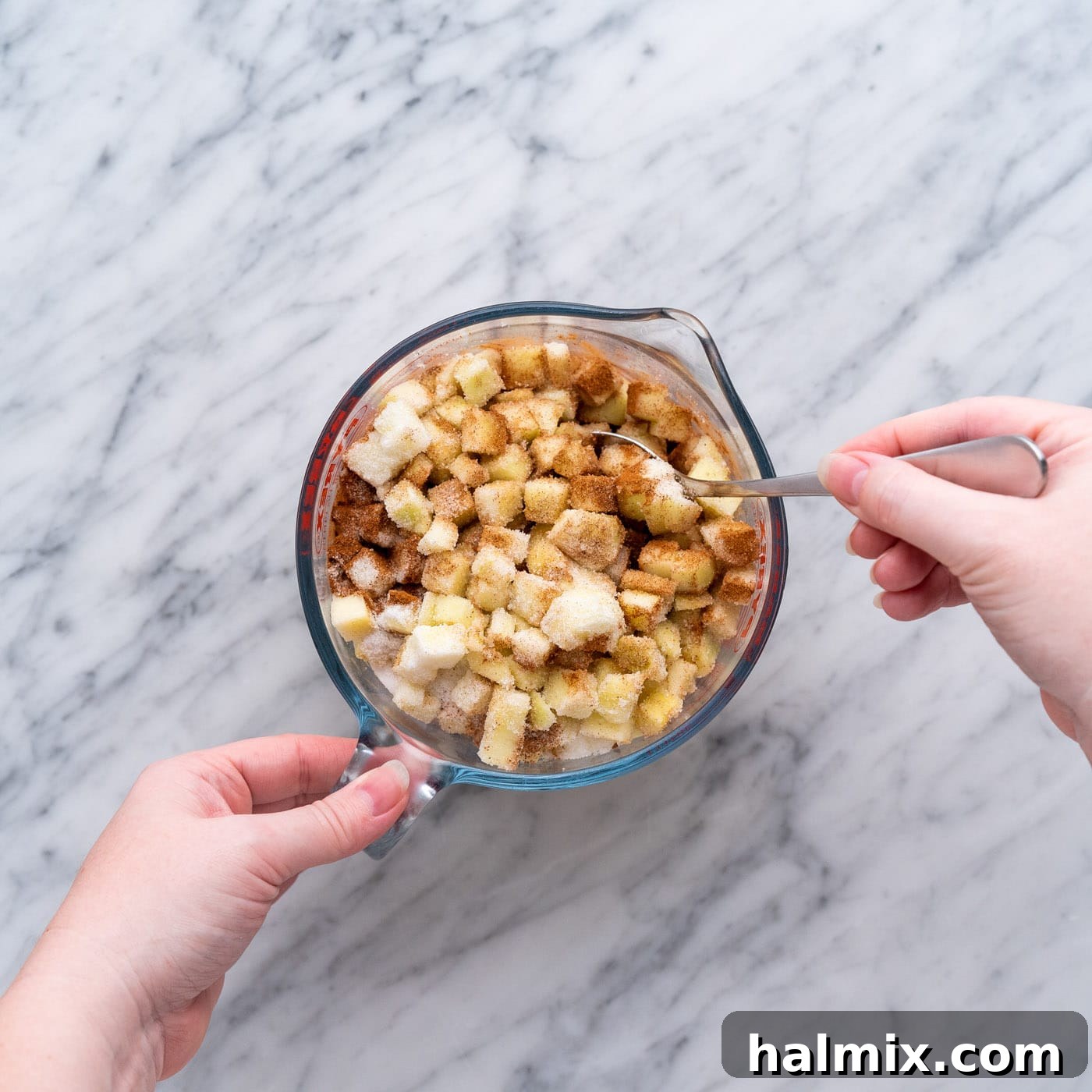 Spiced Apple Caramel Cheesecake Bars 5 mixing chopped apples with spices and sugar