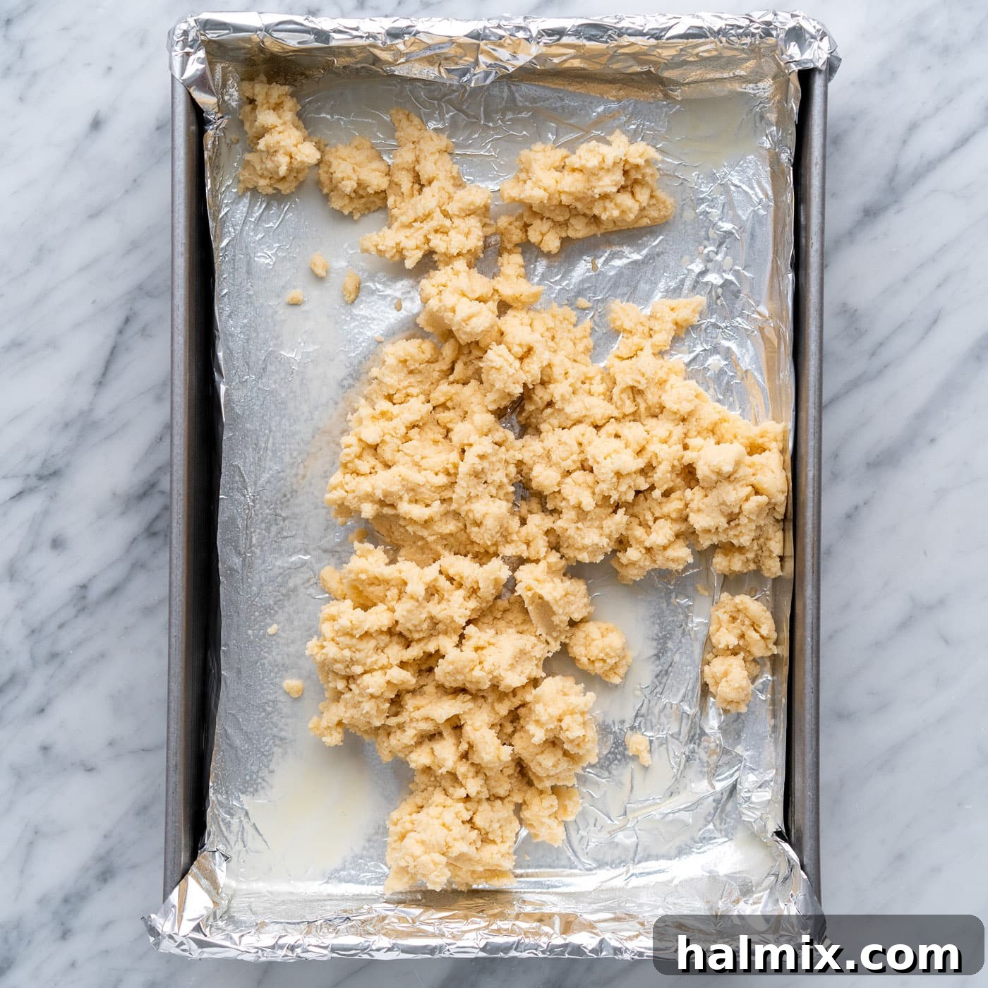 Spiced Apple Caramel Cheesecake Bars 9 shortbread crust on top of a baking pan