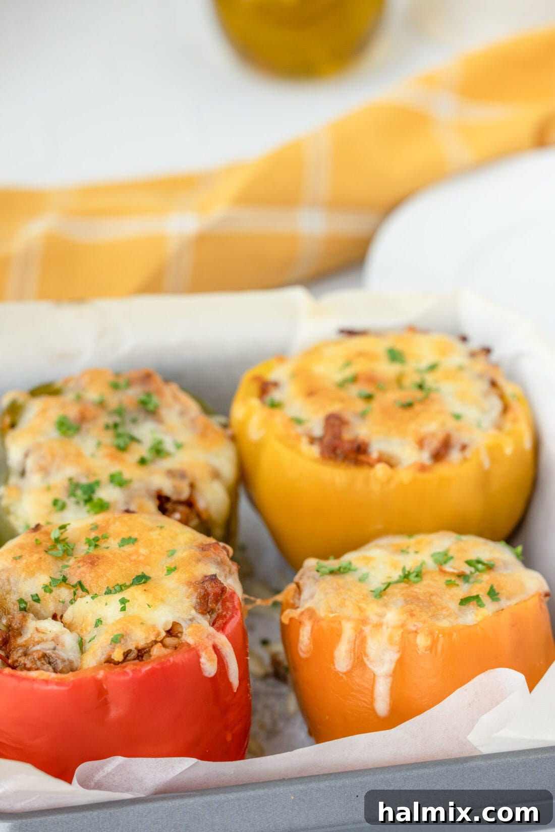Savory Stuffed Peppers 2 Stuffed Peppers in a pan, colorful and inviting