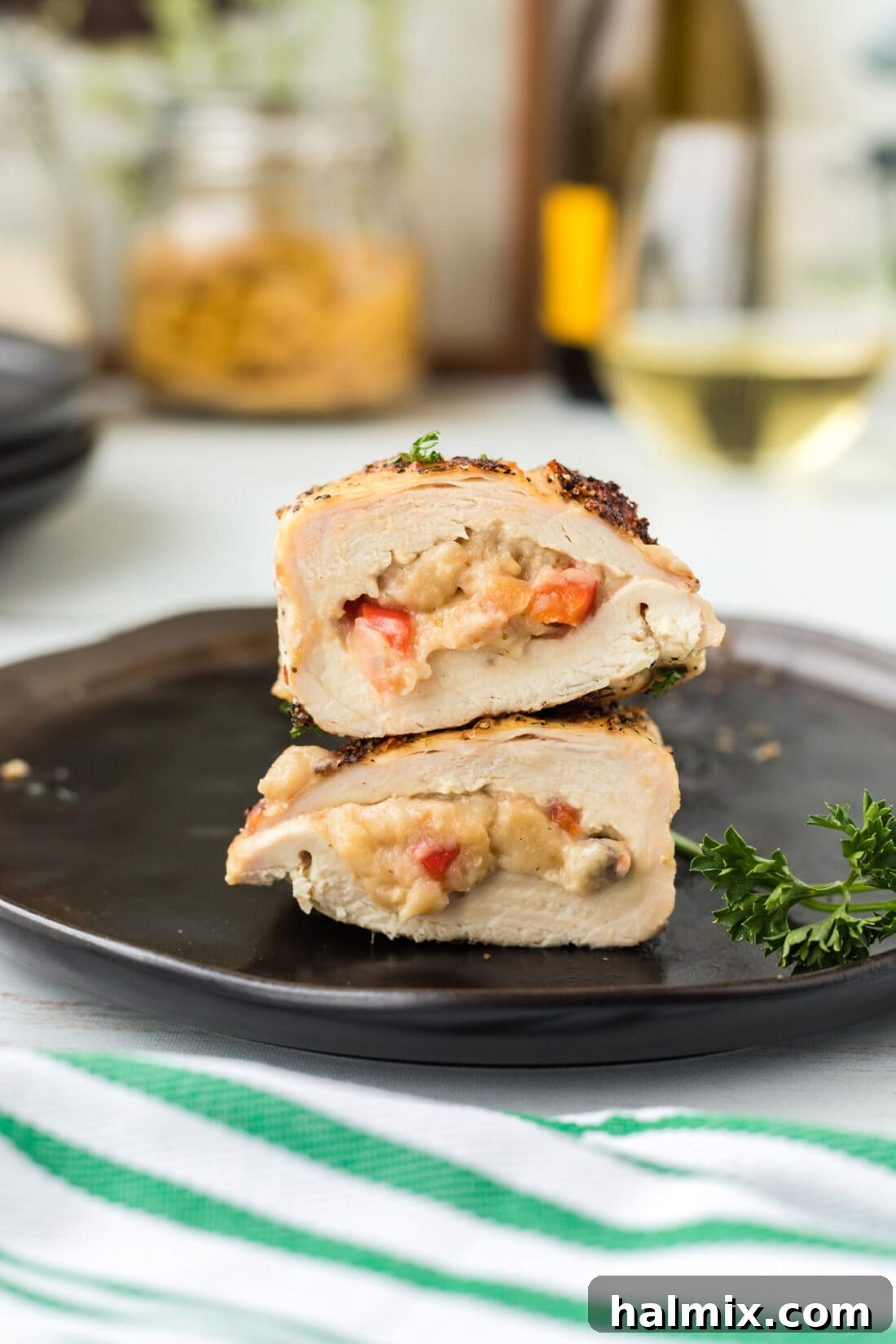Perfectly Stuffed Chicken Roulade 13 Perfectly cooked Stuffed Chicken Breast, cut in half to show the rich filling, served on a plate