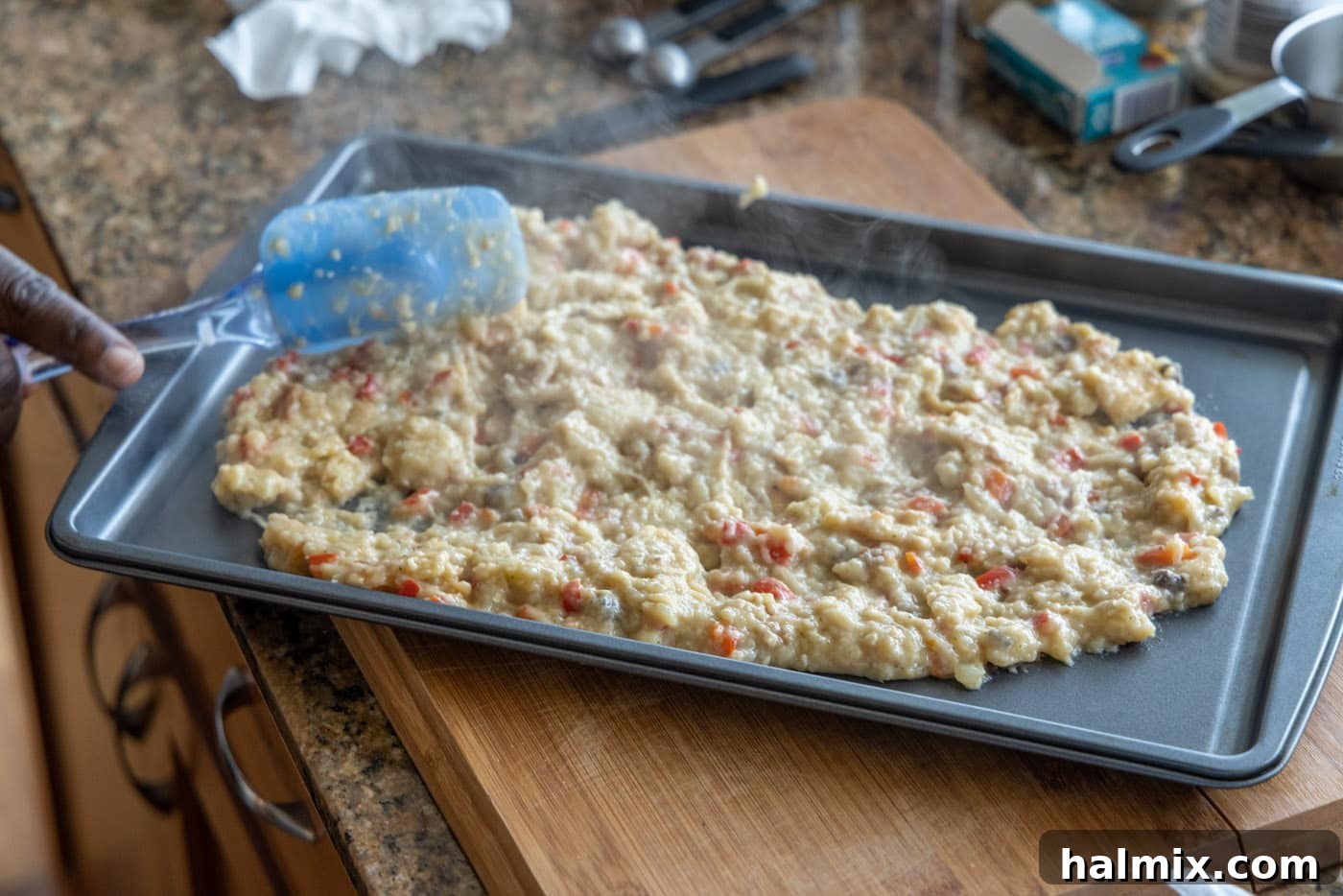 Perfectly Stuffed Chicken Roulade 7 Spreading the stuffed chicken breast filling onto a baking sheet to cool