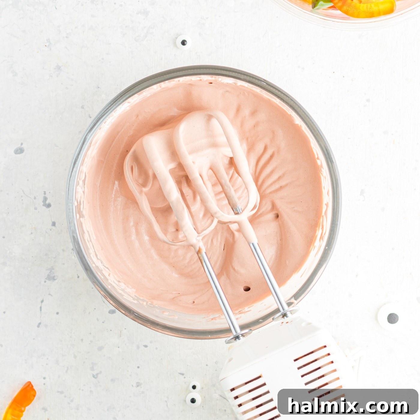 The blended mixture of chocolate pudding and Cool Whip in a bowl, showcasing its creamy, uniform texture after mixing.