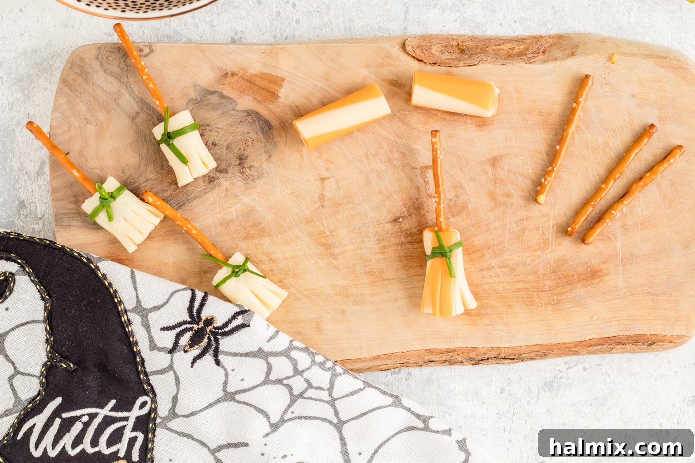 Cheesy Pretzel Broomsticks 10 A completed cheese and pretzel broomstick with the pretzel handle inserted into the cheese, ready for Halloween.