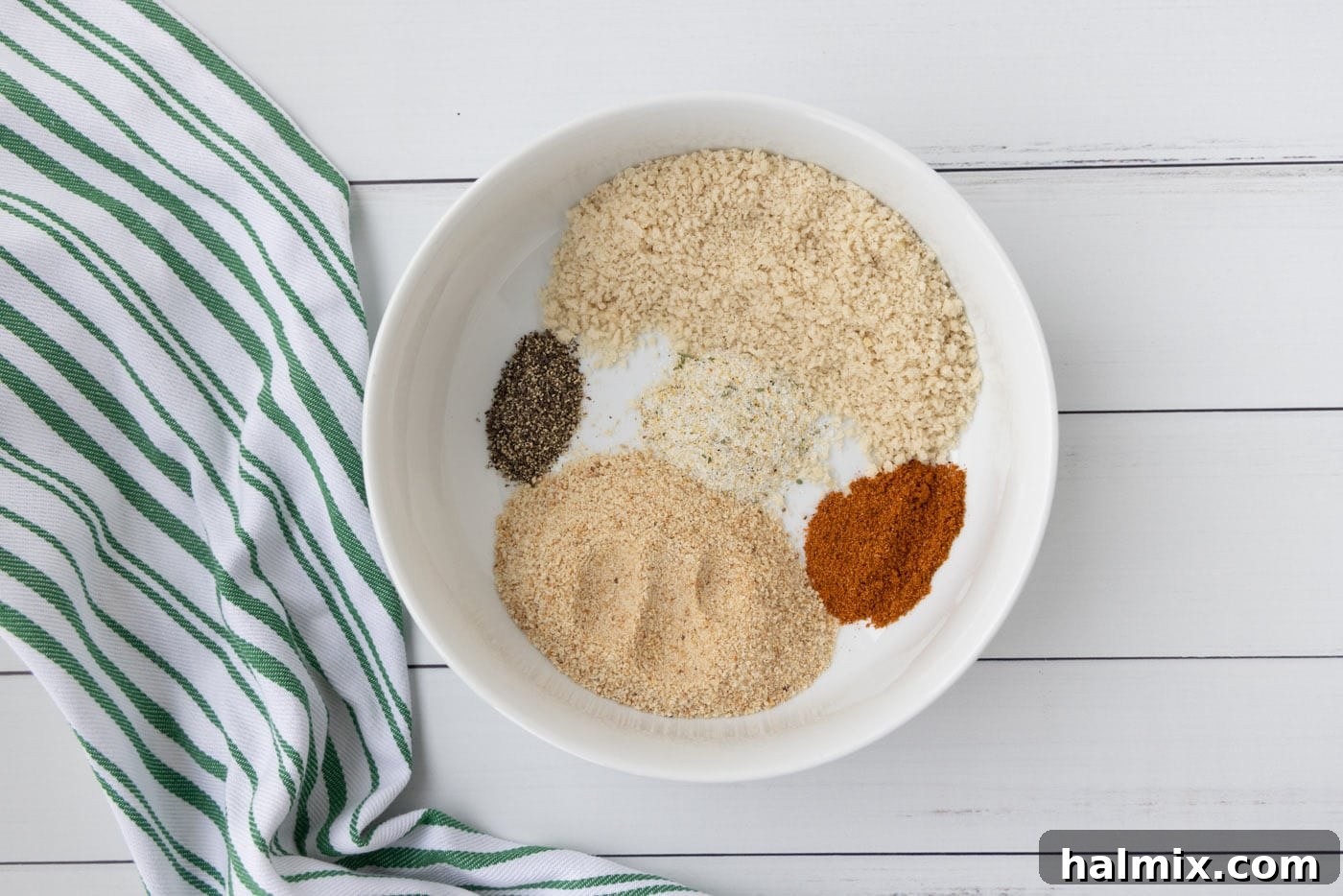 Bowl containing the mixed shrimp breadcrumbs and seasonings