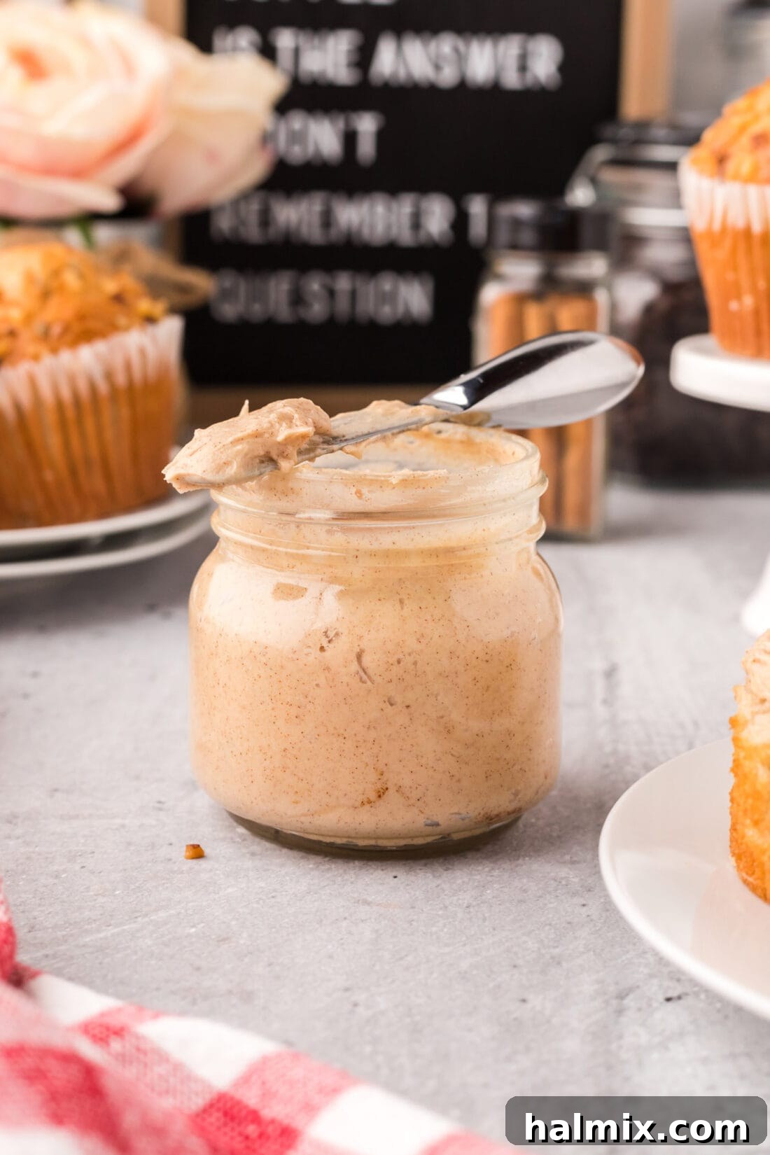 Jar of homemade Cinnamon Honey Butter with a knife