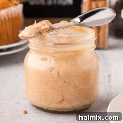 Cinnamon Honey Butter in a jar, showcasing its smooth texture