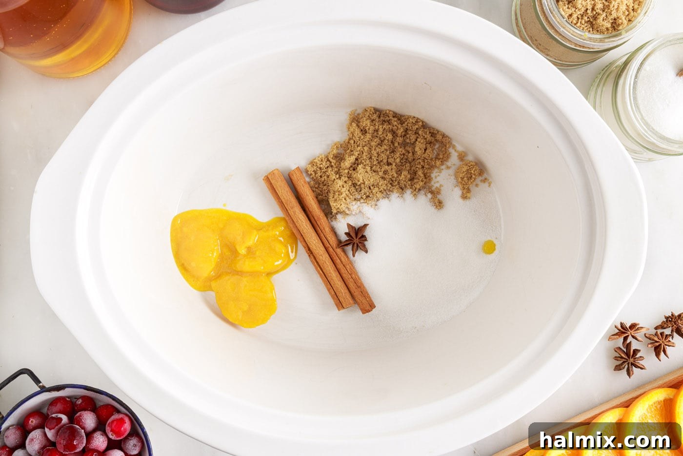 Warm Cranberry Elixir 5 Orange juice concentrate, sugars, cinnamon sticks and star anise in crockpot