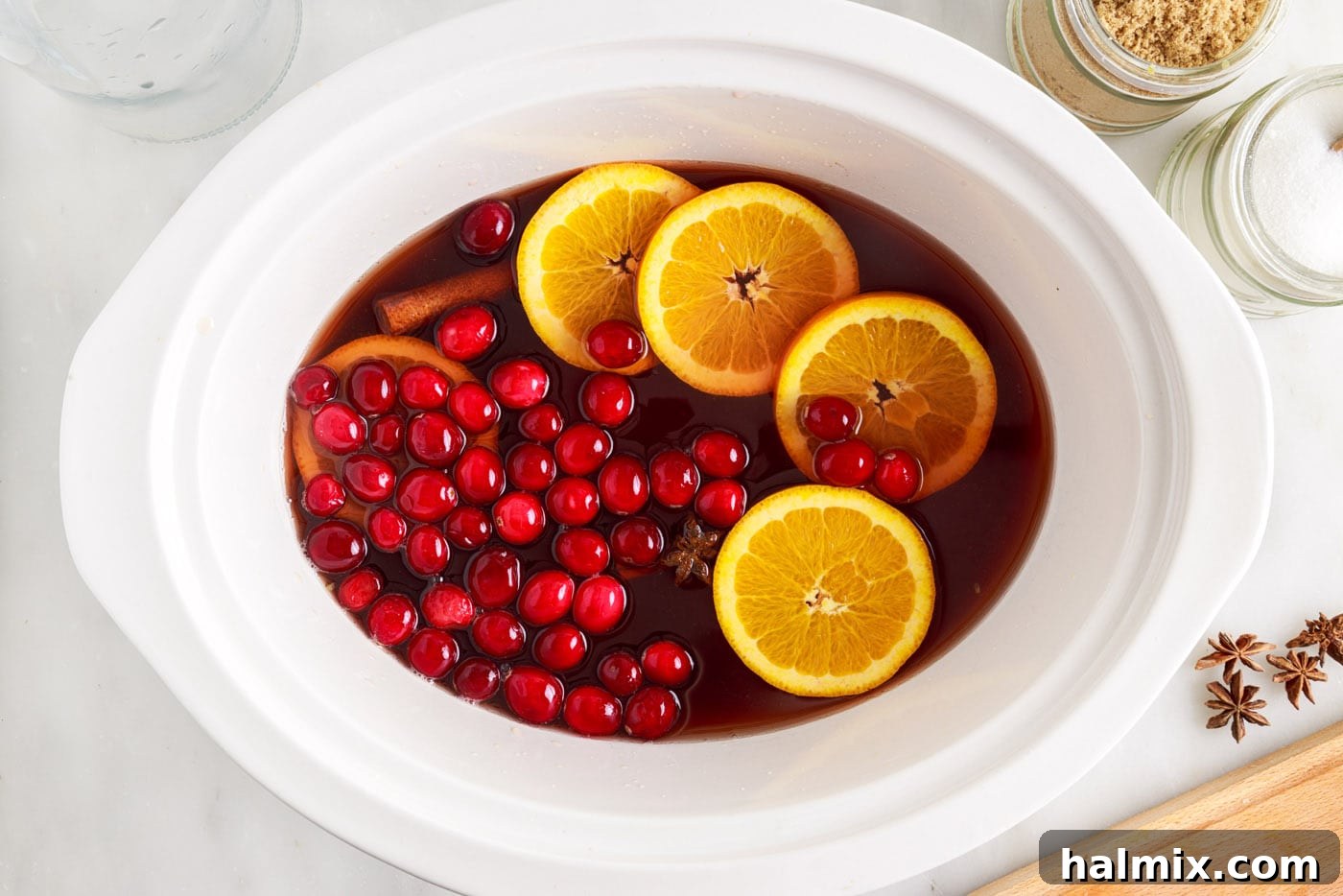 Warm Cranberry Elixir 7 Orange slices and cranberries in hot cranberry punch in the slow cooker