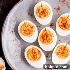 Spiced Pumpkin Deviled Bites 11 Pumpkin Deviled Eggs on a gray plate