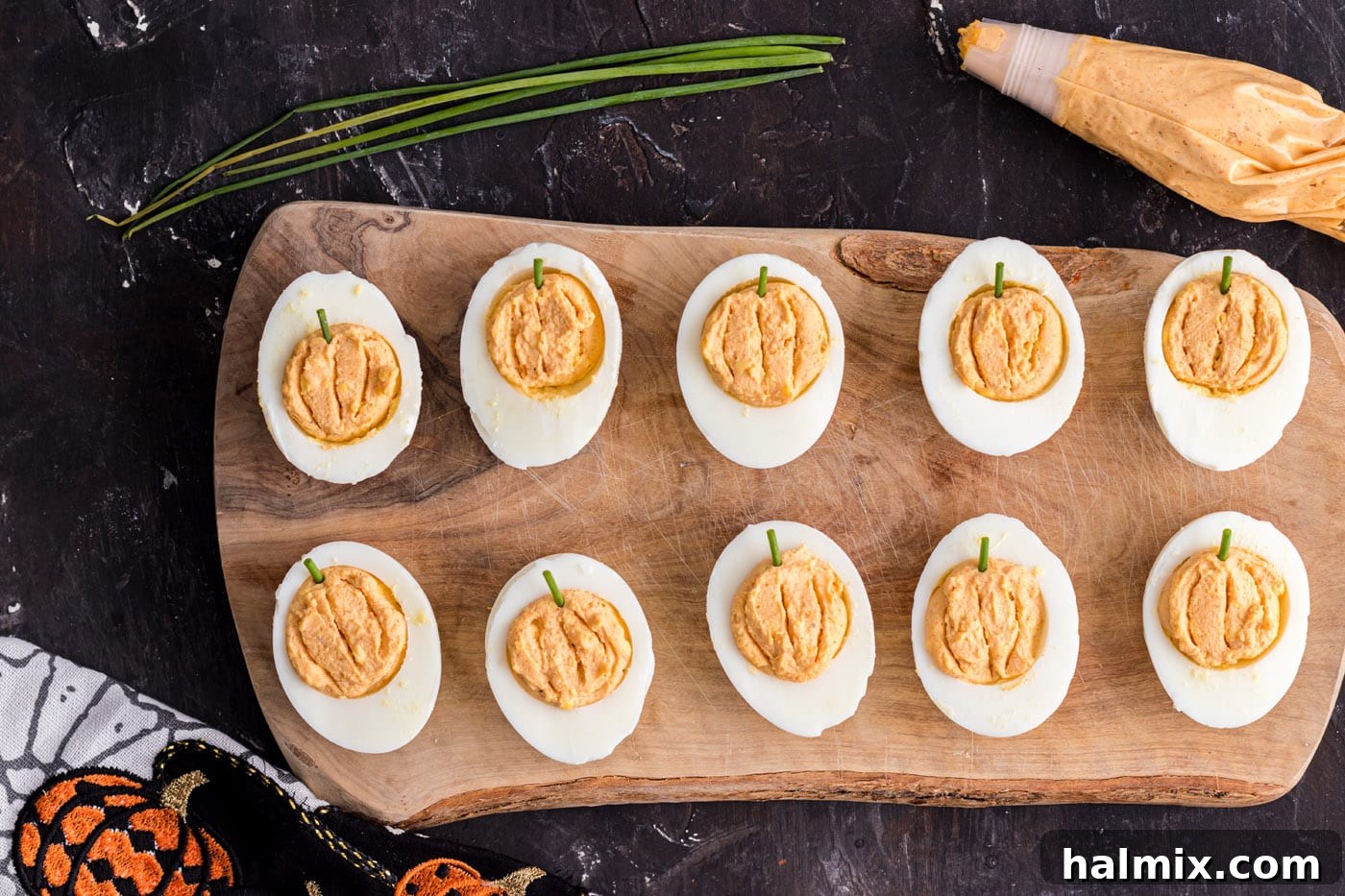 Spiced Pumpkin Deviled Bites 9 Easy pumpkin deviled eggs with chives as stems