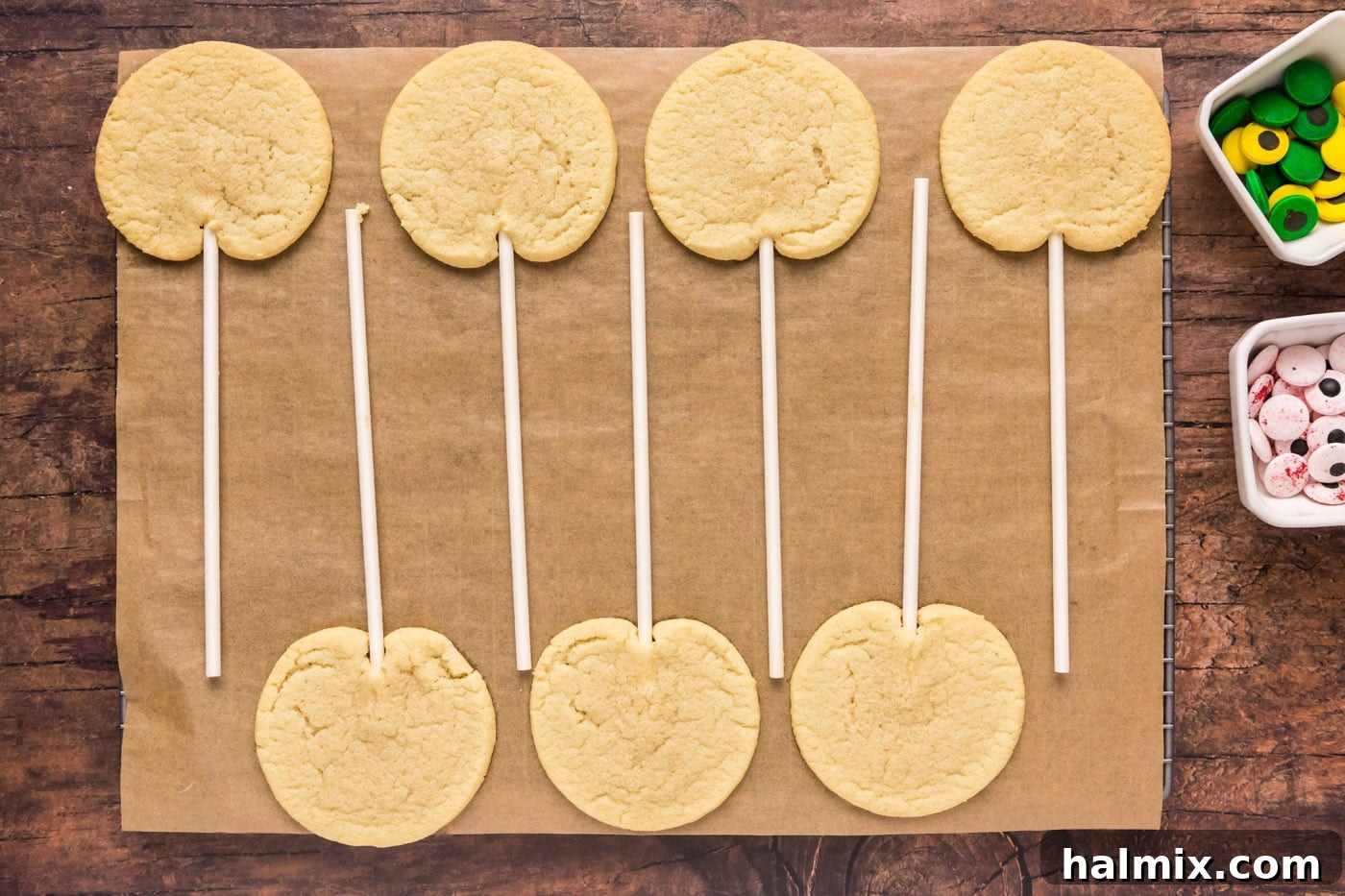 Baked cookie pops cooling on a wire rack