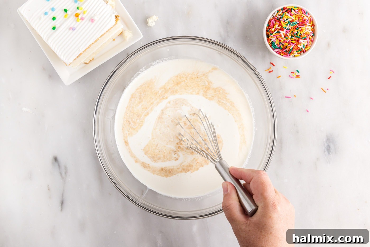 whisking sweetened condensed milk, heavy cream, salt and vanilla in a bowl