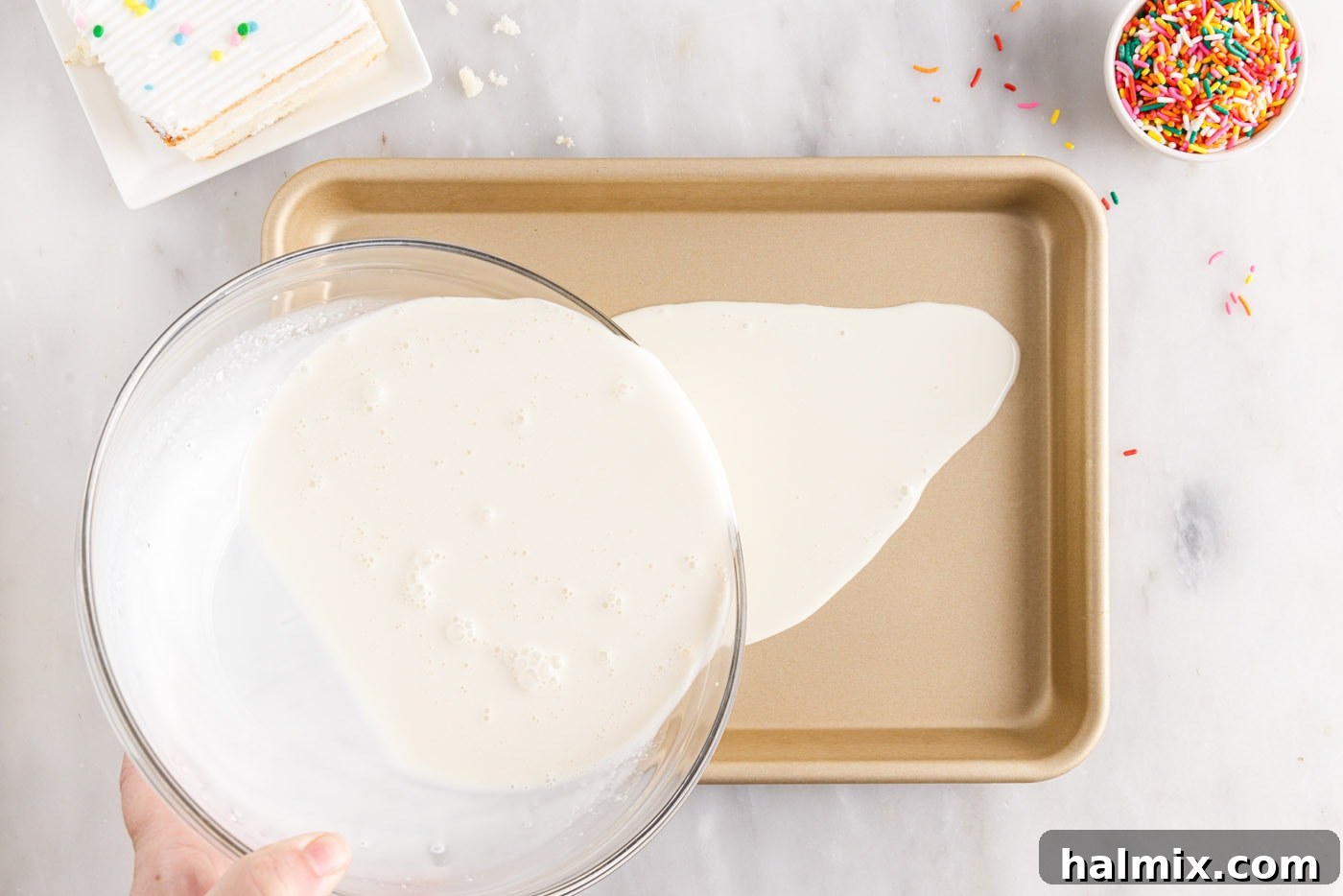 pouring ice cream mixture into a sheet pan