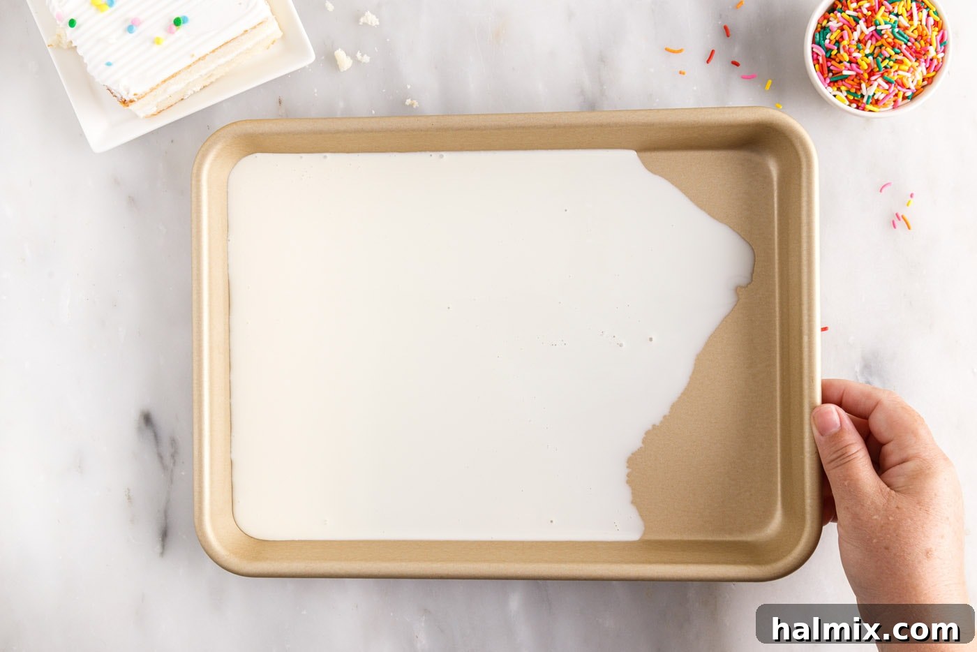 spreading ice cream mixture in a sheet pan
